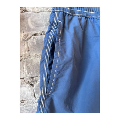 Men's Hartford Nautic Blue swim trunks with matching pochette, featuring classic design and comfortable fit.
