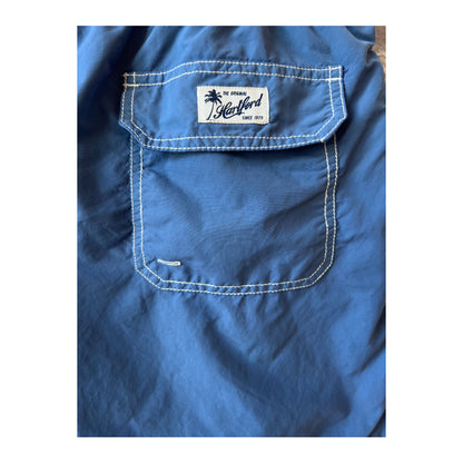 Men's Hartford Nautic Blue classic swim trunks with matching pochette, featuring a stylish and comfortable design for swimming and beachwear.
