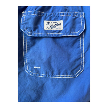 Hartford Men's classic ocean swim trunks with matching pochette, featuring a stylish and comfortable design.