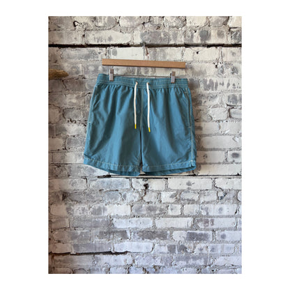Men's classic swim trunks and matching pochette in sage from Hartford Men's, featuring a comfortable fit and stylish design.