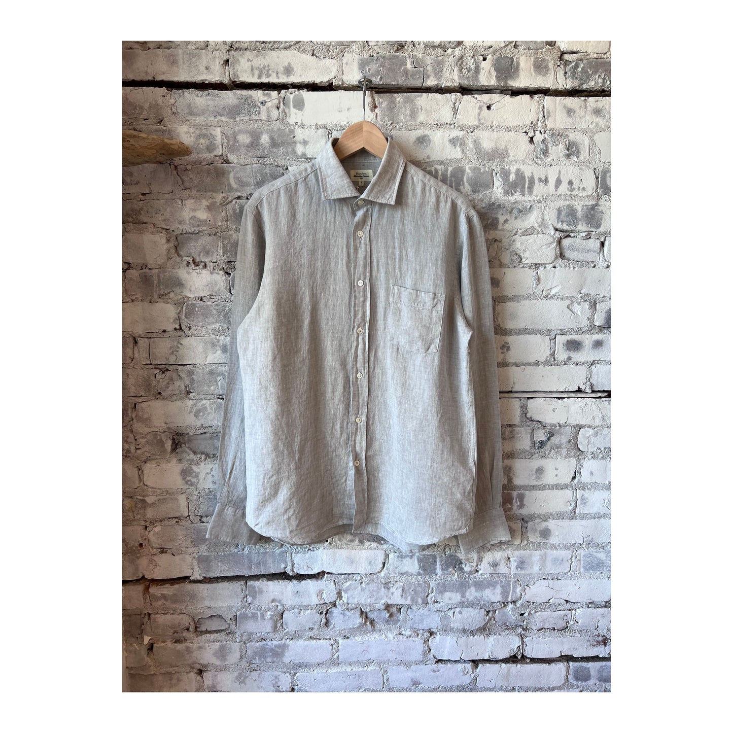 Men's Hartford Paul Linen Chambray Shirt in grey, lightweight and casual with a button-down collar, displayed on a hanger.