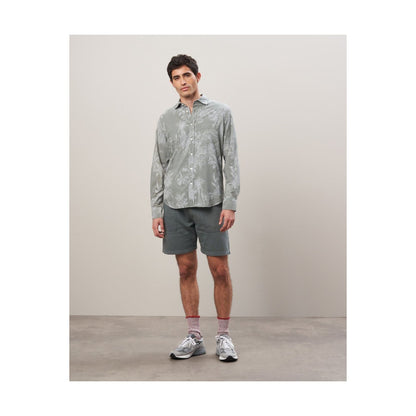 Men's olive cotton shirt with palm tree print by Hartford Men's, featuring a casual, tropical-inspired design.