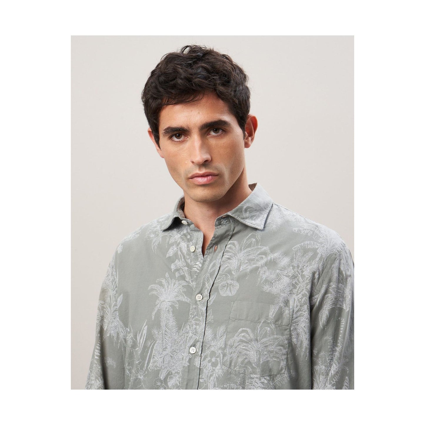 Men's olive cotton shirt with palm tree print by Hartford Men's, casual style, shown on a hanger.