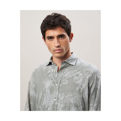 Men's olive cotton shirt with palm tree print by Hartford Men's, casual style, shown on a hanger.