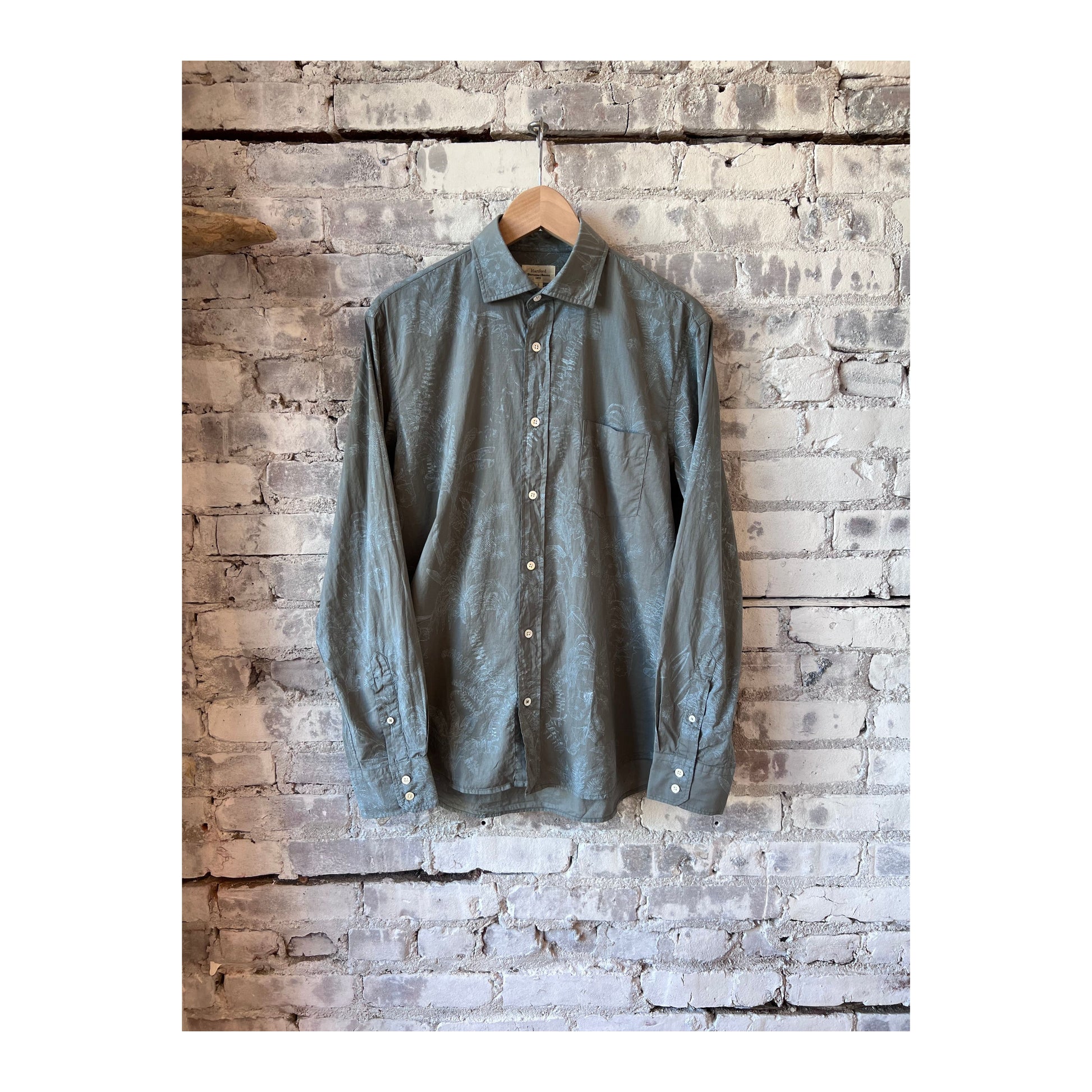Men's olive cotton shirt with palm tree print by Hartford Men's, featuring a casual, tropical-inspired design.
