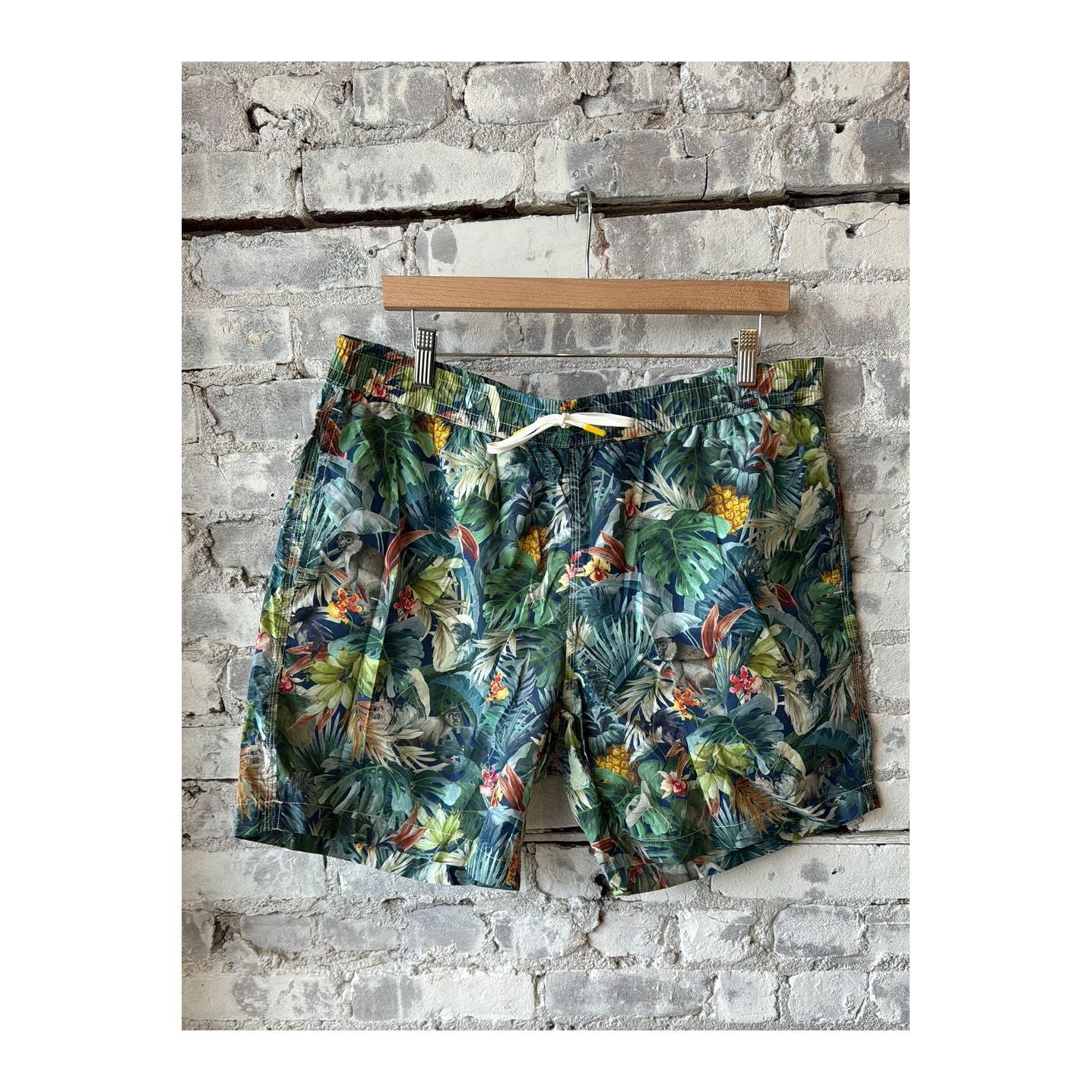 Men's printed swim shorts in jungle navy with vibrant jungle leaf pattern, by Hartford Men's, perfect for beach or pool.