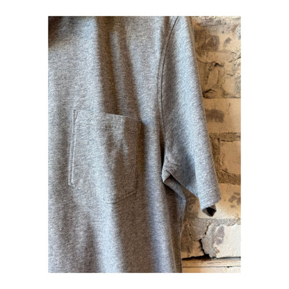 Men's Hartford Heather Grey SS Cotton Jersey Polo shirt displayed on a hanger, showcasing its classic polo design and soft fabric.
