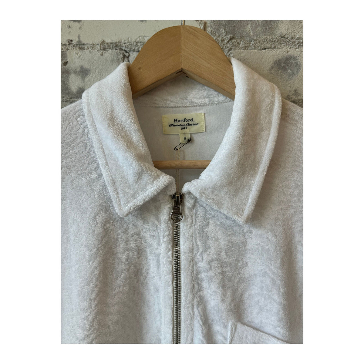Men's white Terry Zip Sweatshirt by Hartford Men's, showing the front view with a full zip closure and soft fabric texture.
