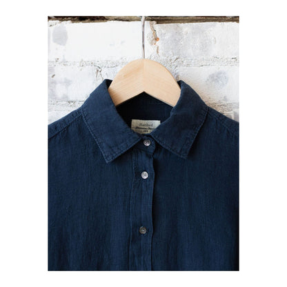 Navy women's Coraz linen shirt by Hartford Women's with button-up front and long sleeves, displayed on a hanger.