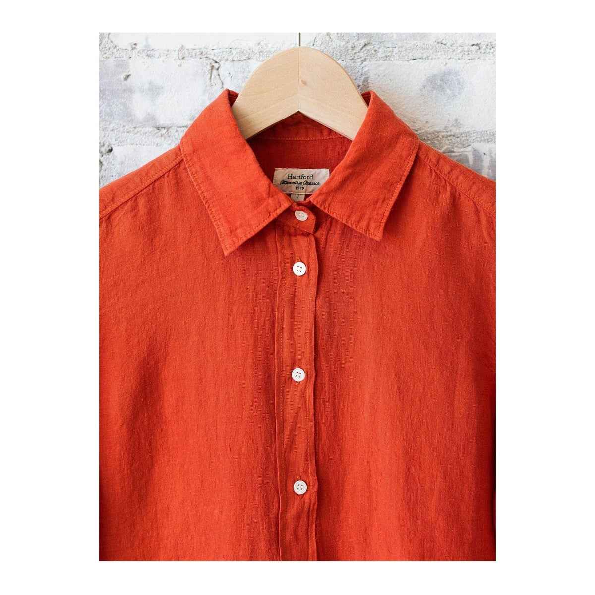 Red women's Coraz Linen Shirt by Hartford Women's, button-up style, shown in a close-up image highlighting fabric and design details.