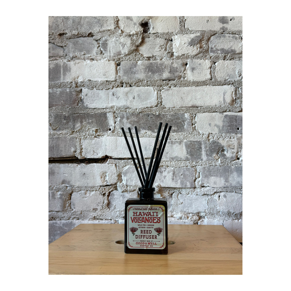 Hawai'i Volcanoes National Park reed diffuser by Good & Well Supply Co. with decorative glass bottle and natural fragrance reeds.