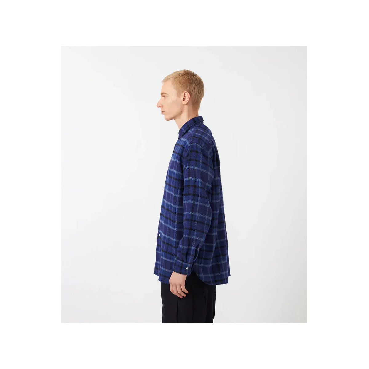 Men's heavy beige and gray plaid flannel shirt by nanamica, showing the soft fabric and classic button-up design.