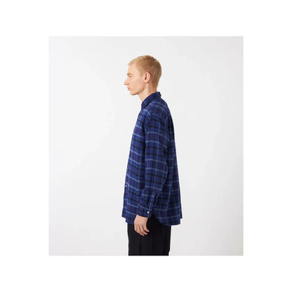 Men's heavy beige and gray plaid flannel shirt by nanamica, showing the soft fabric and classic button-up design.