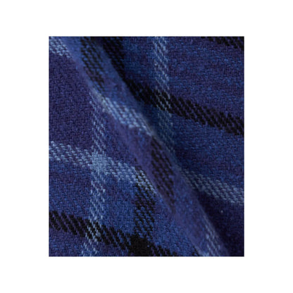 Men's beige and gray plaid flannel shirt by nanamica, featuring a classic heavy flannel fabric and button-down style.