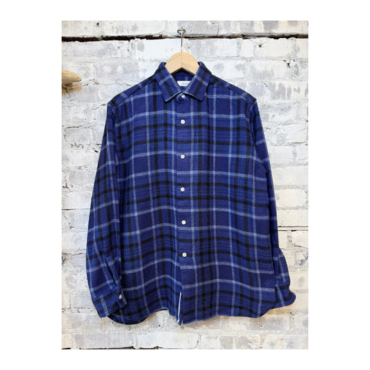 Men's heavy flannel shirt by nanamica in navy and cobalt plaid, featuring a button-up front and classic collar.