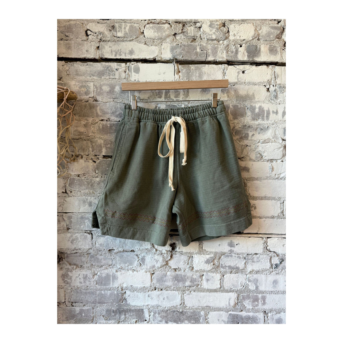 Men's heavyweight gym class shorts in pond green by MONOSTERO, displayed on a model with a relaxed fit and athletic style.