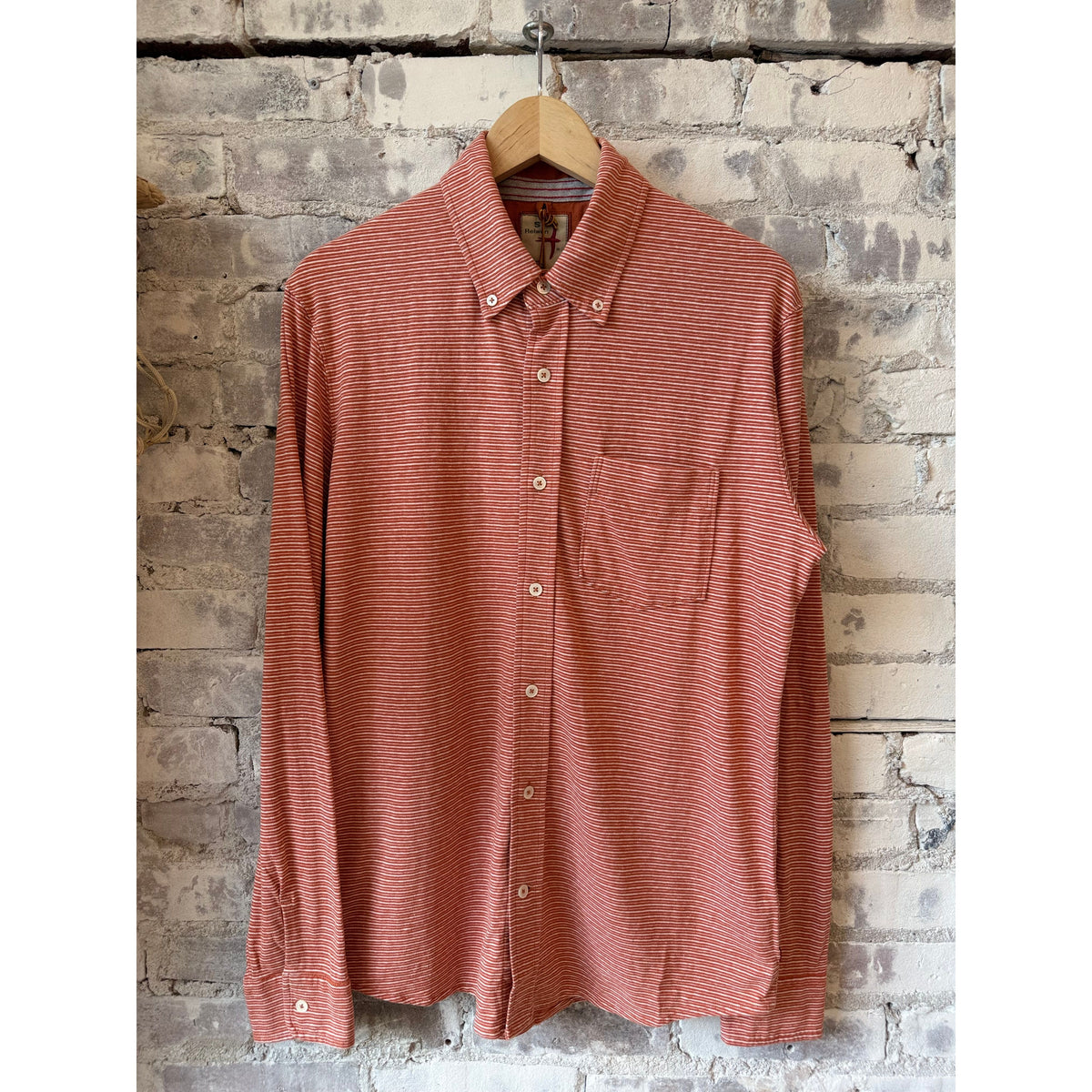 Men's hemp stripe buttondown shirt by Relwen in burnt orange and white, featuring a classic collar and button front.