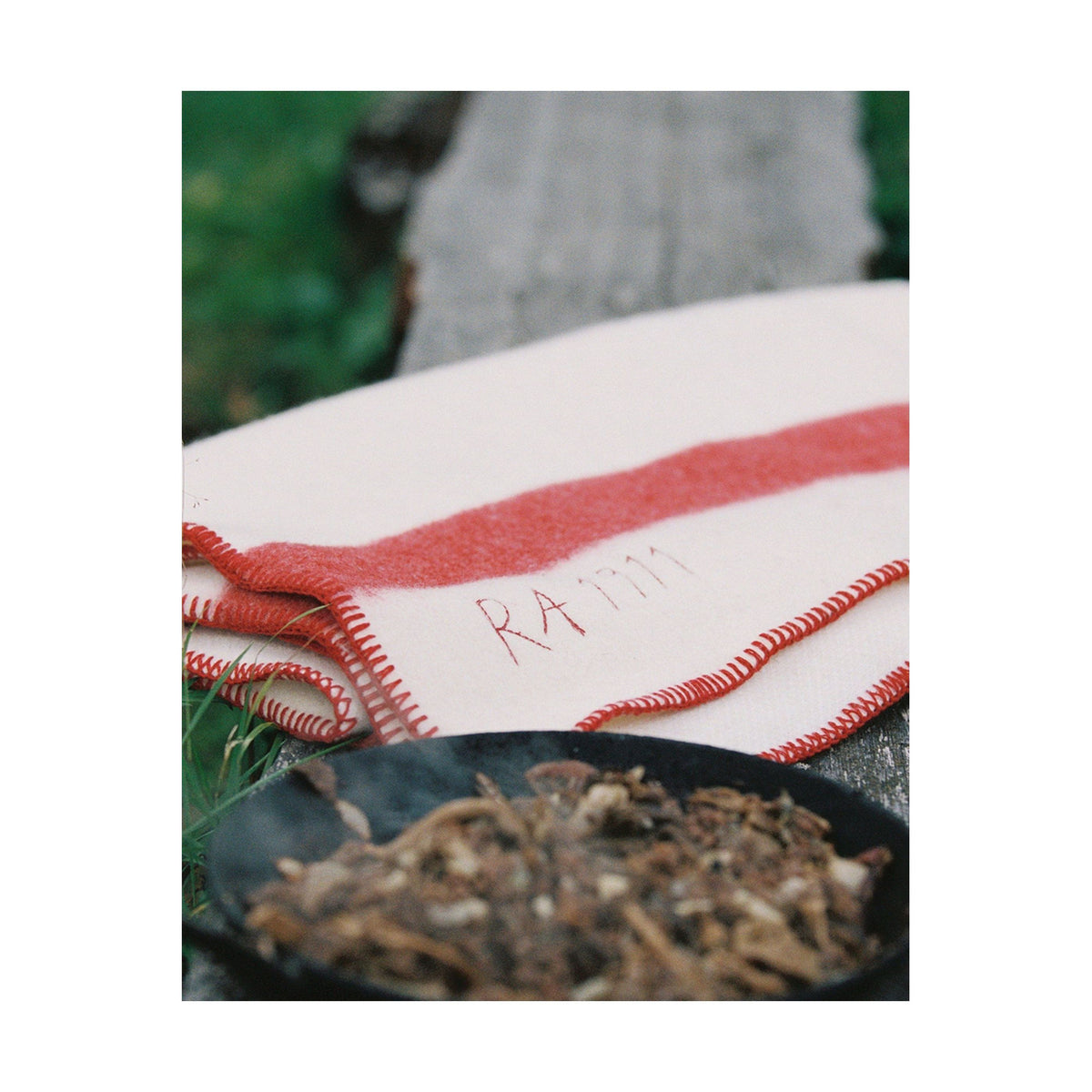 Amundsen Herdsman Blanket in faded navy, soft accessories with a cozy, woven texture, perfect for layering or comfort.