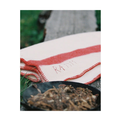 Amundsen Herdsman Blanket in faded navy, soft accessories with a cozy, woven texture, perfect for layering or comfort.