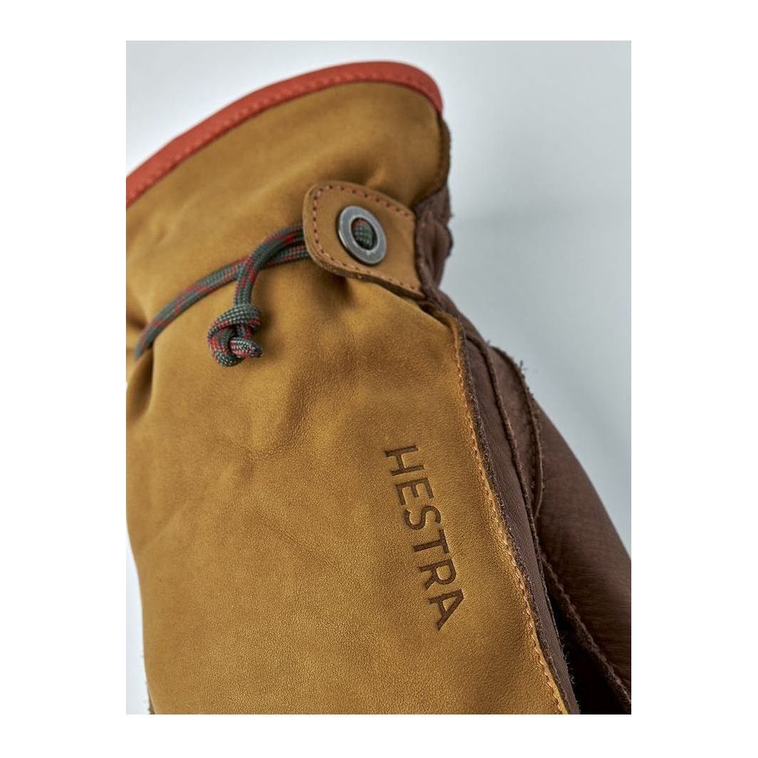 Men's Hestra Wakayama Mitt in cork and brown leather, showing the insulated, soft interior and durable exterior design.