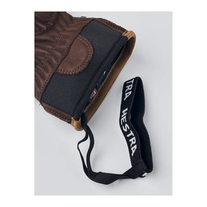 Men's Hestra Wakayama Mitt in navy and brown, made of durable leather with detailed stitching and warm lining.