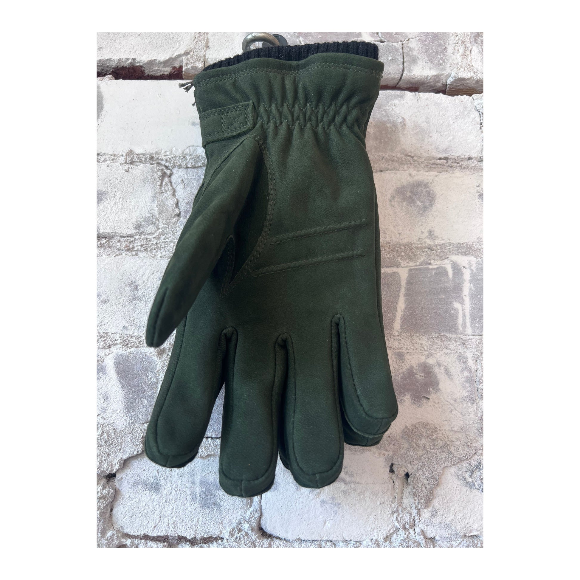 Men's Bergvik Hestra glove in bottle green, showcasing the stylish and warm winter glove with soft leather and textured details.