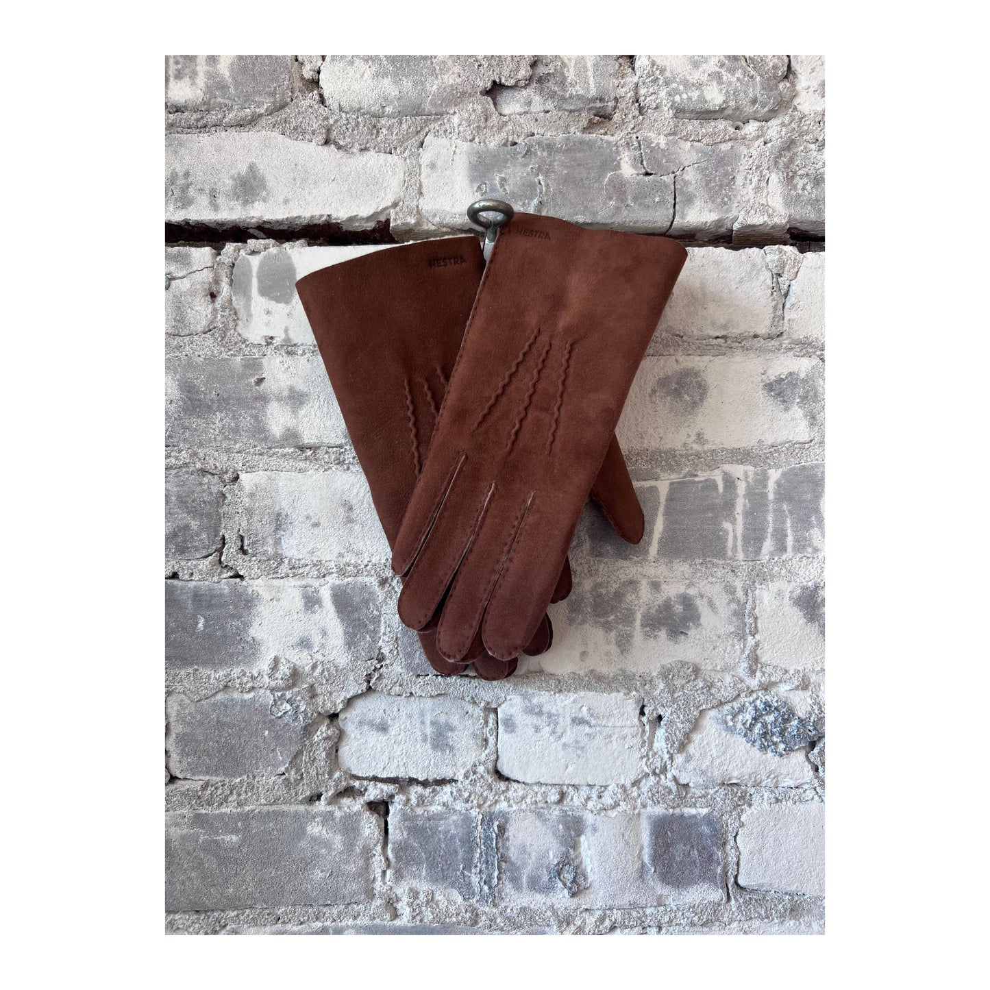 Hestra Bernard men's brown glove with soft leather exterior and warm lining, designed for stylish winter wear.