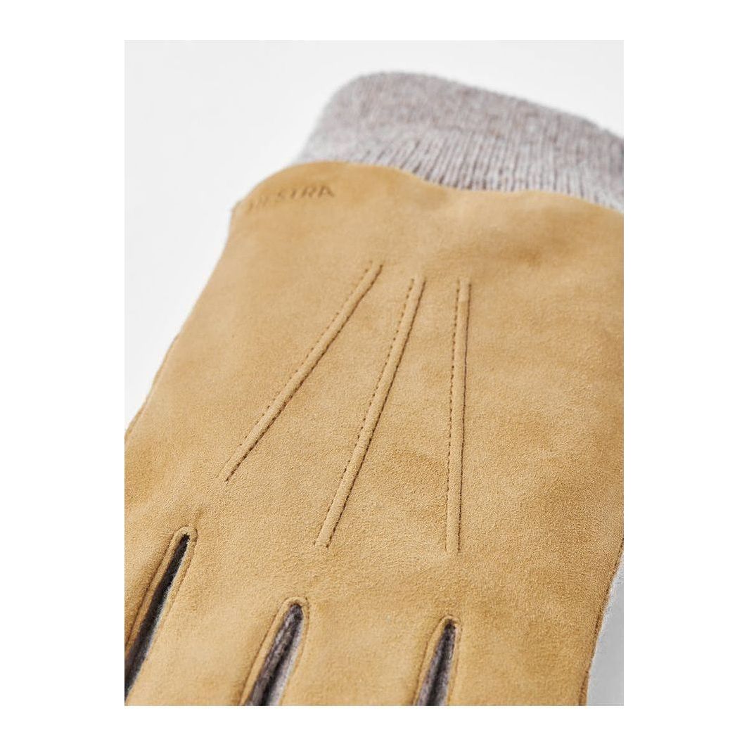 Men's Hestra Geoffrey Camel Glove showing soft leather exterior and detailed stitching on a neutral background.