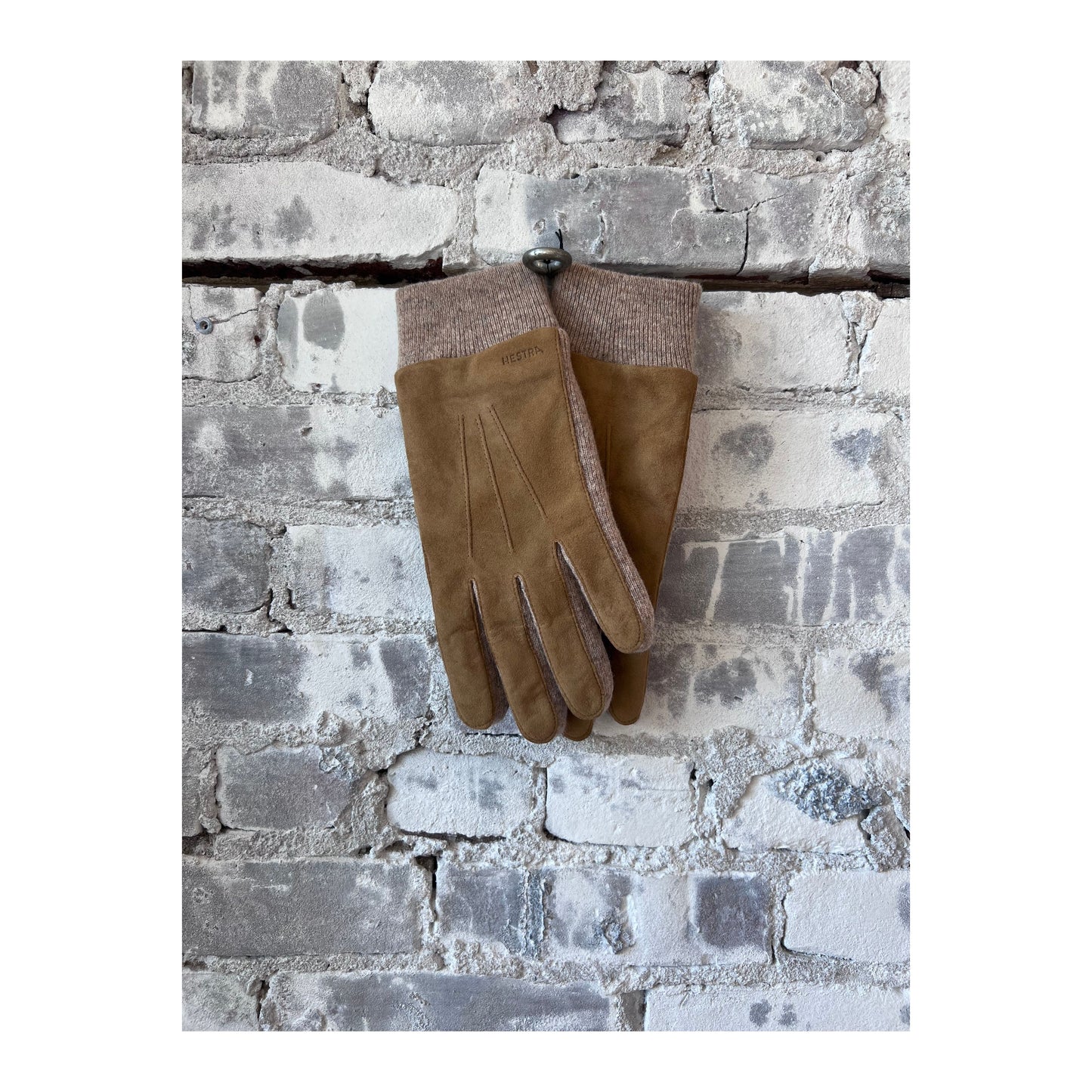 Men's Hestra Geoffrey Camel Glove showing soft leather exterior and detailed stitching on a neutral background