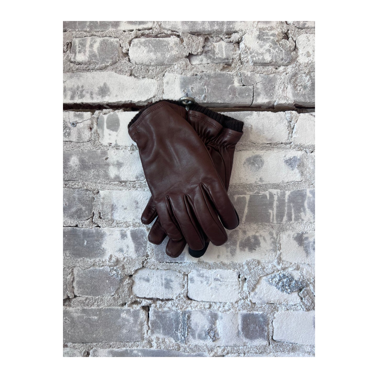 Men's Hestra John Glove in brown leather, showing close-up of soft, durable men's glove with detailed stitching.
