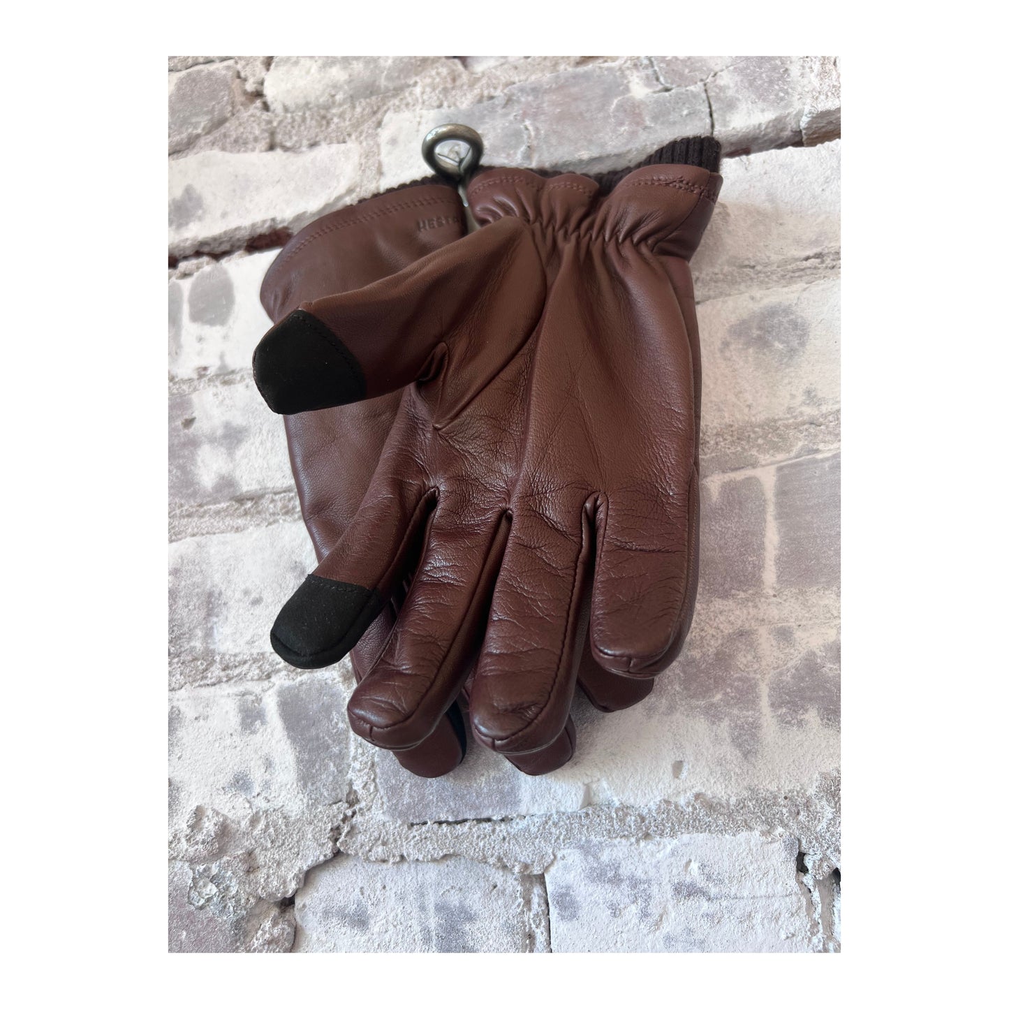 Hestra John men's brown leather gloves with detailed stitching and comfortable fit, perfect for cold weather.