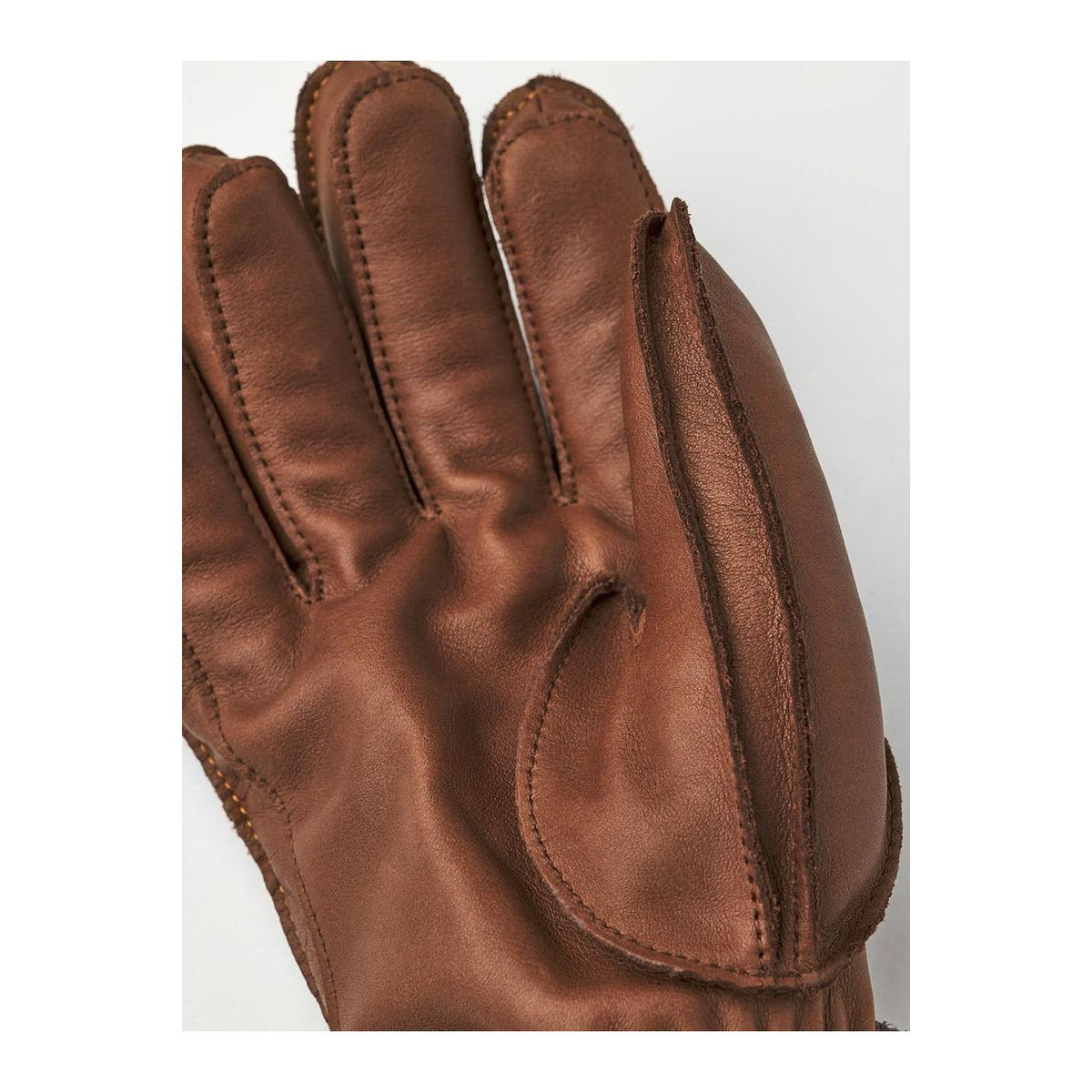 Men's Hestra Wakayama 5-Finger Glove in cork and brown leather, showing detailed stitching and flexible finger design.