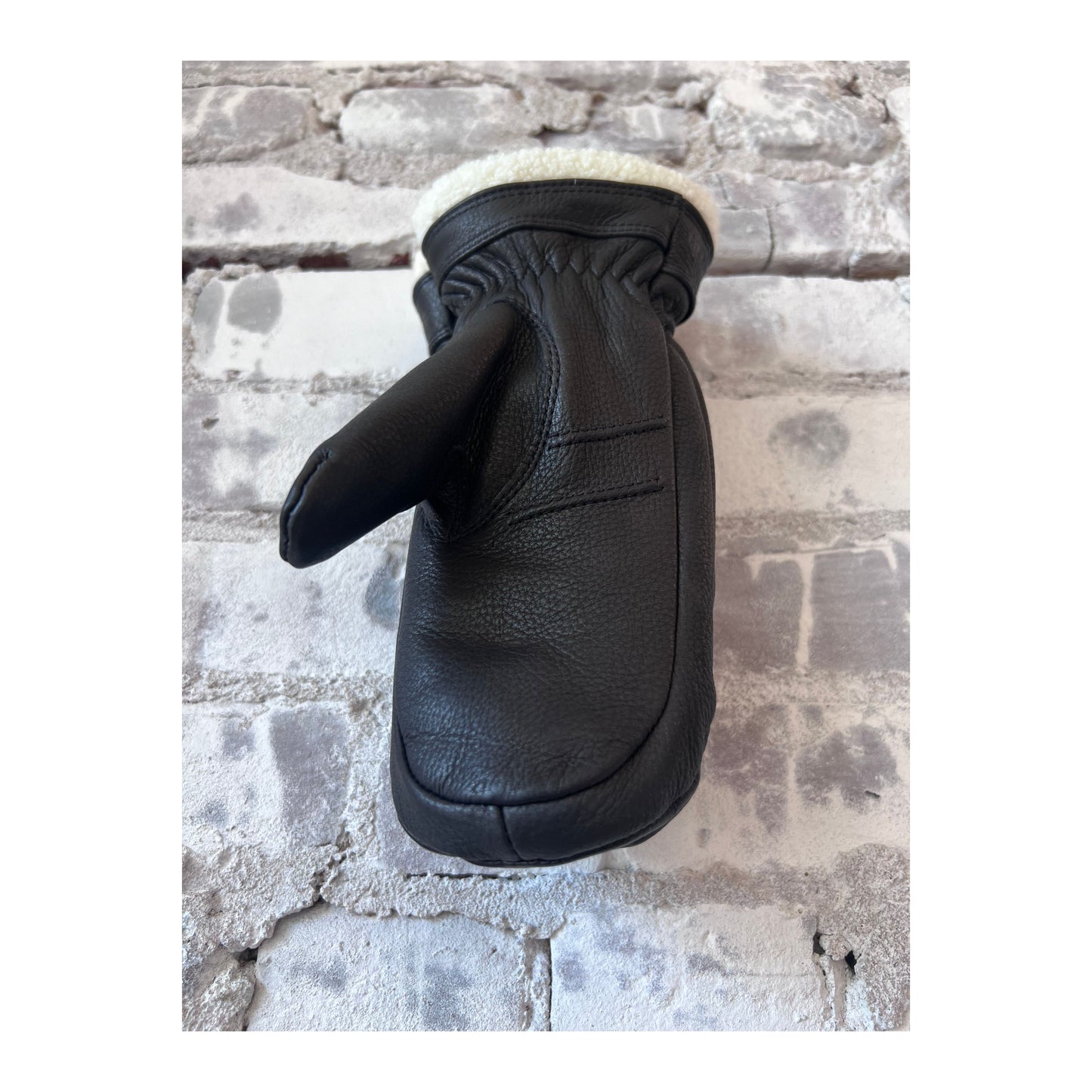 Women's Hestra Boda Mitt in black, showcasing the insulated winter glove with a sleek, durable design and cozy lining.