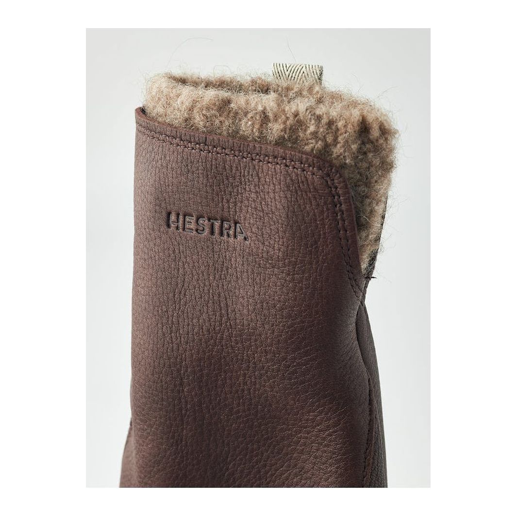 Women's Hestra Tiril Mitt in chocolate color, showing the insulated exterior and cozy lining for cold weather protection.
