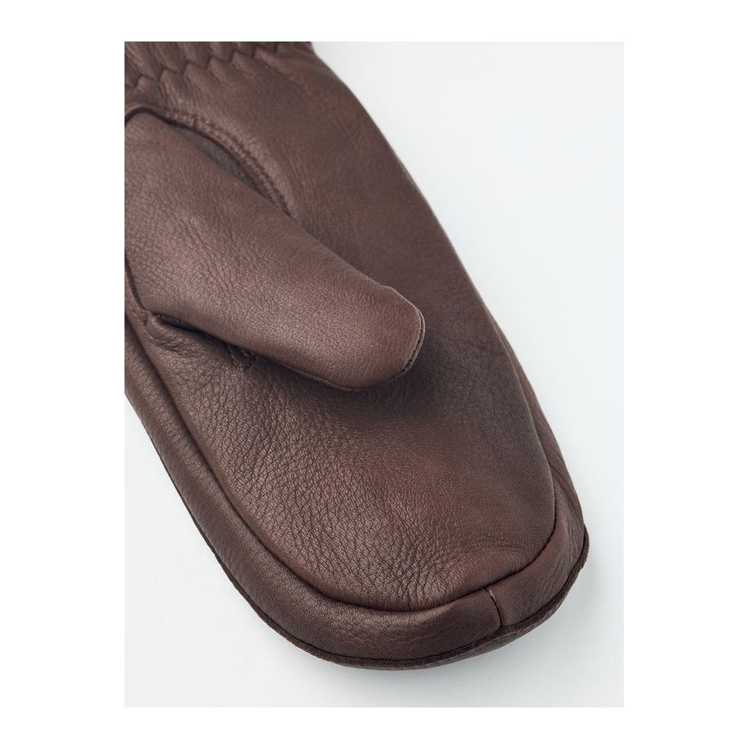 Hestra Tiril Mitt for women, chocolate-colored winter gloves with insulated lining and adjustable wrist straps.
