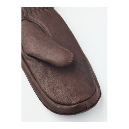 Hestra Tiril Mitt for women, chocolate-colored winter gloves with insulated lining and adjustable wrist straps.