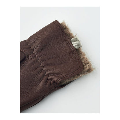 Women's Hestra Tiril Mitt in chocolate color, showcasing insulated winter gloves with a sleek design and durable materials.