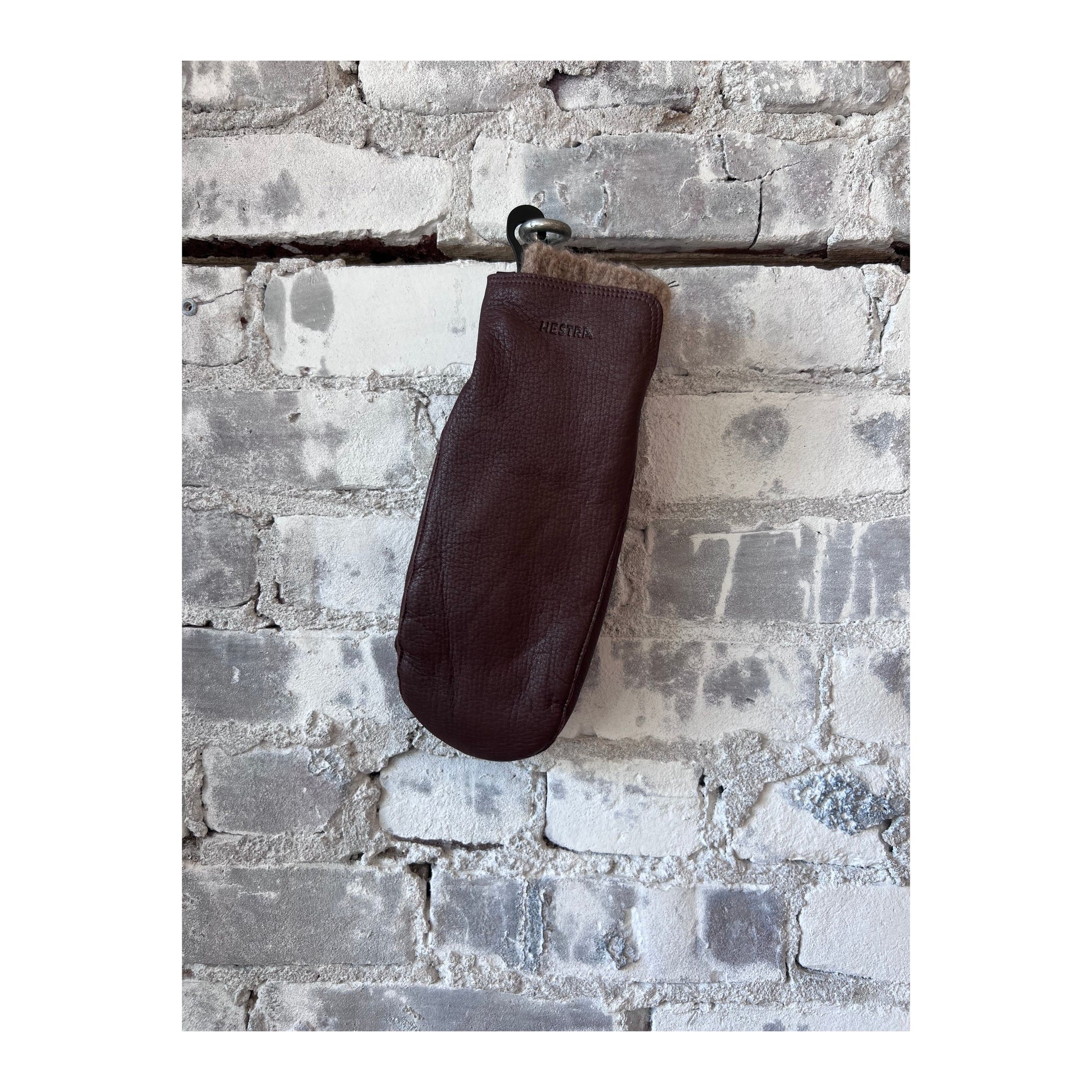 Women's Hestra Tiril Mitt in chocolate, insulated winter glove with leather exterior and cozy lining for cold weather.