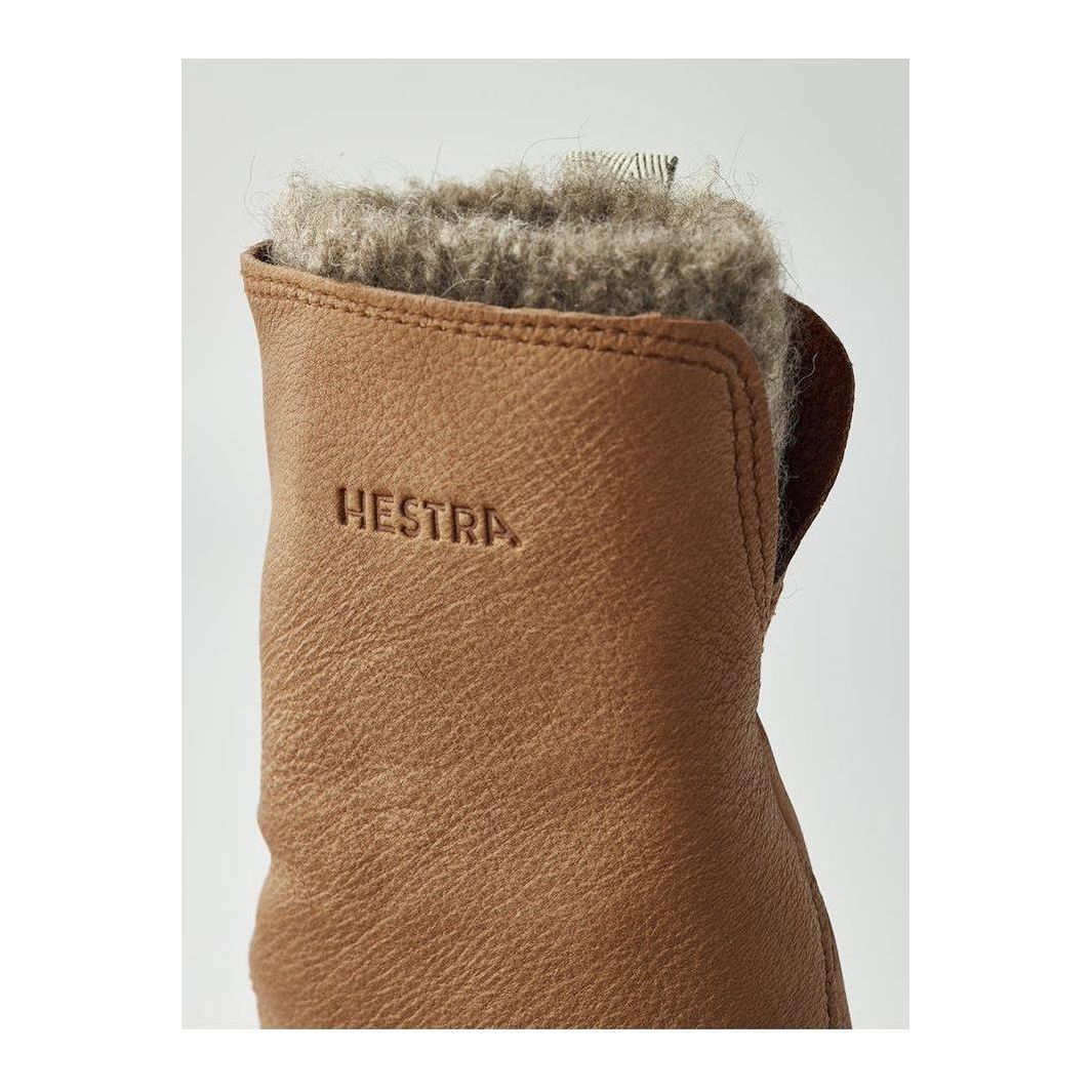 Women's Hestra Tiril Mitt in cork leather, showcasing the warm, durable exterior with soft lining and secure wrist closure.
