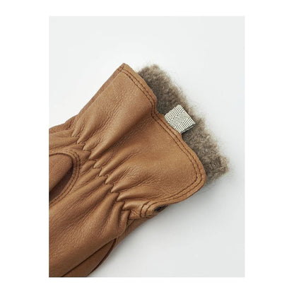 Women's Hestra Tiril Mitt made of cork, showing a close-up of the warm, insulated glove with textured cork exterior.
