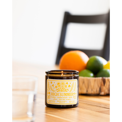 Folk & Flame High Summer Soy Candle by Good & Well Supply Co. in a glass jar, ideal for home decor and summer ambiance.