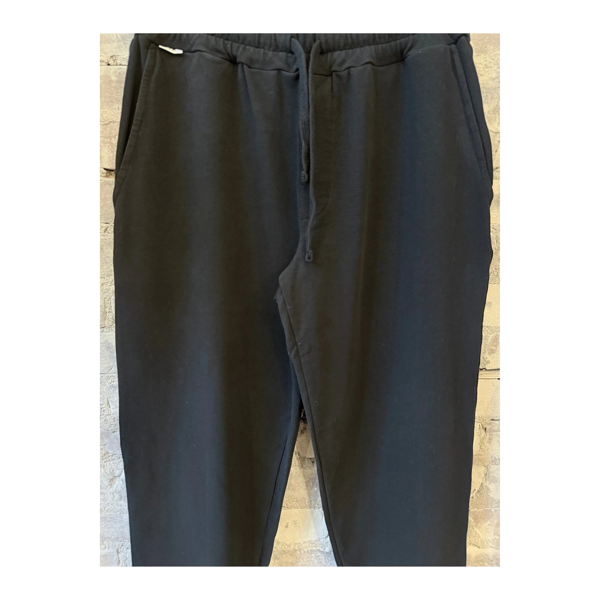Men's black IF Jogger pants by 04651, featuring a comfortable fit and casual style, displayed on a hanger.