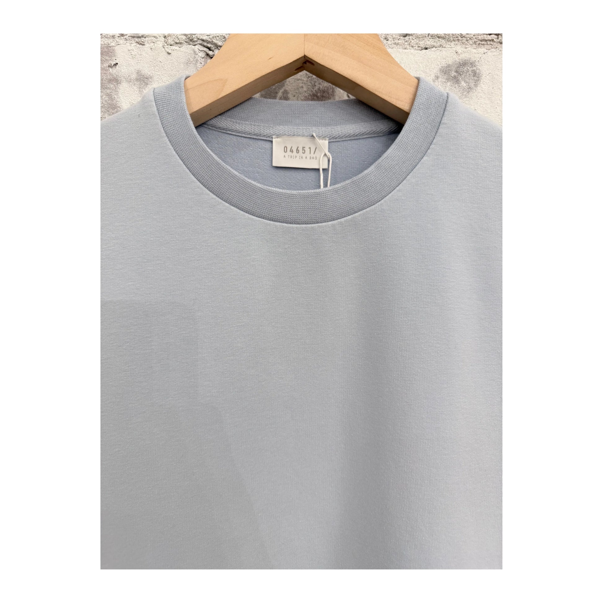 Men's sky blue IF Tee by 04651/ featuring a casual fit and soft fabric, displayed on a hanger against a neutral background.