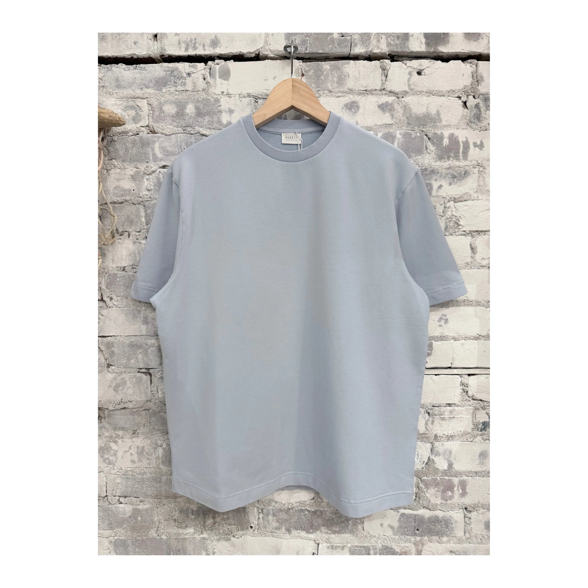 Men's sky blue IF Tee by 04651/ featuring a casual fit and soft fabric, shown on a model with a relaxed style.