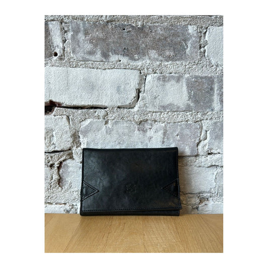 Black vintage leather tri-fold wallet by Il Bisonte, showcasing multiple card slots and classic design.