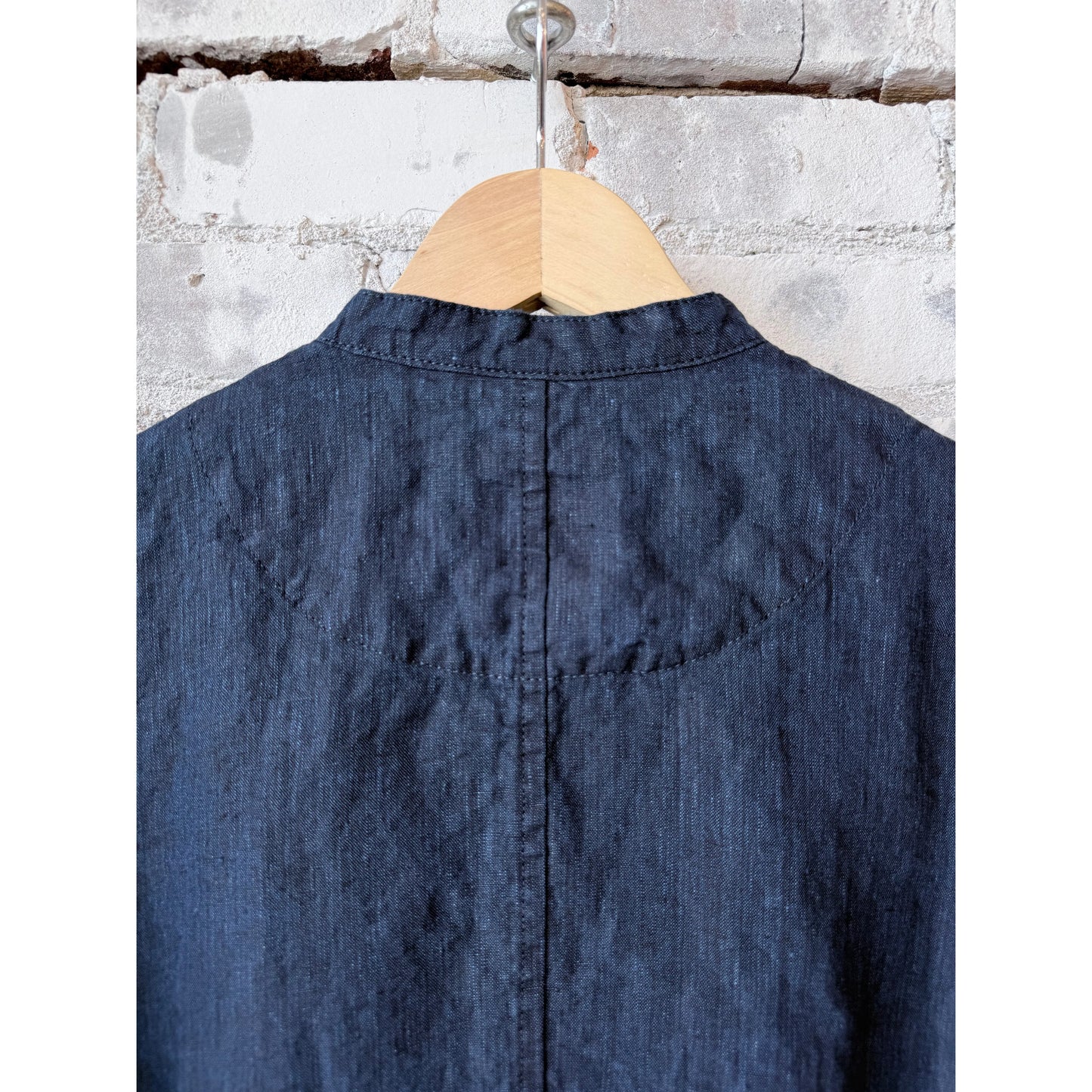 Women's dark indigo linen chambray jacket by Pas de Calais, featuring lightweight fabric and classic tailoring.