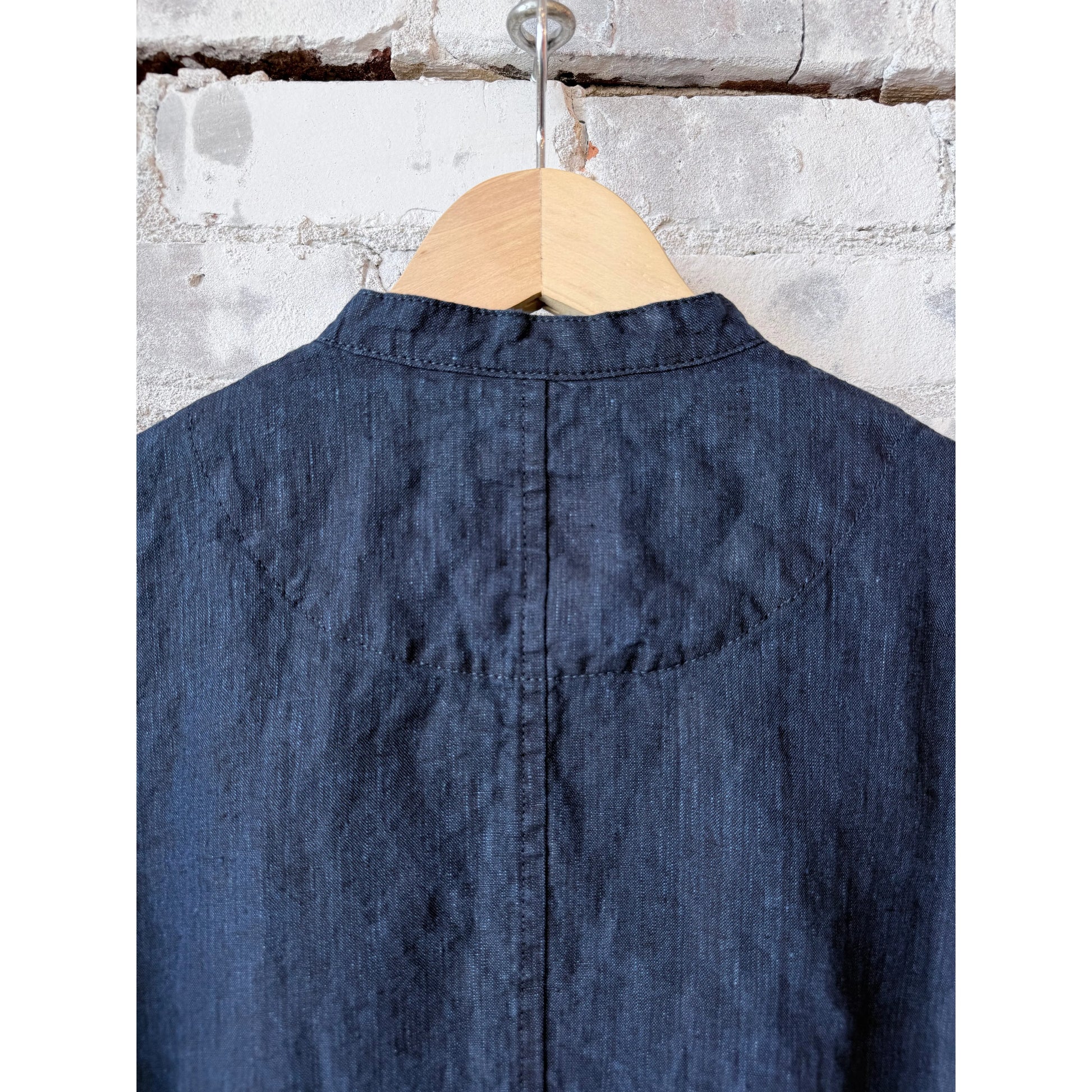 Women's dark indigo linen chambray jacket by Pas de Calais, featuring lightweight fabric and classic tailoring.