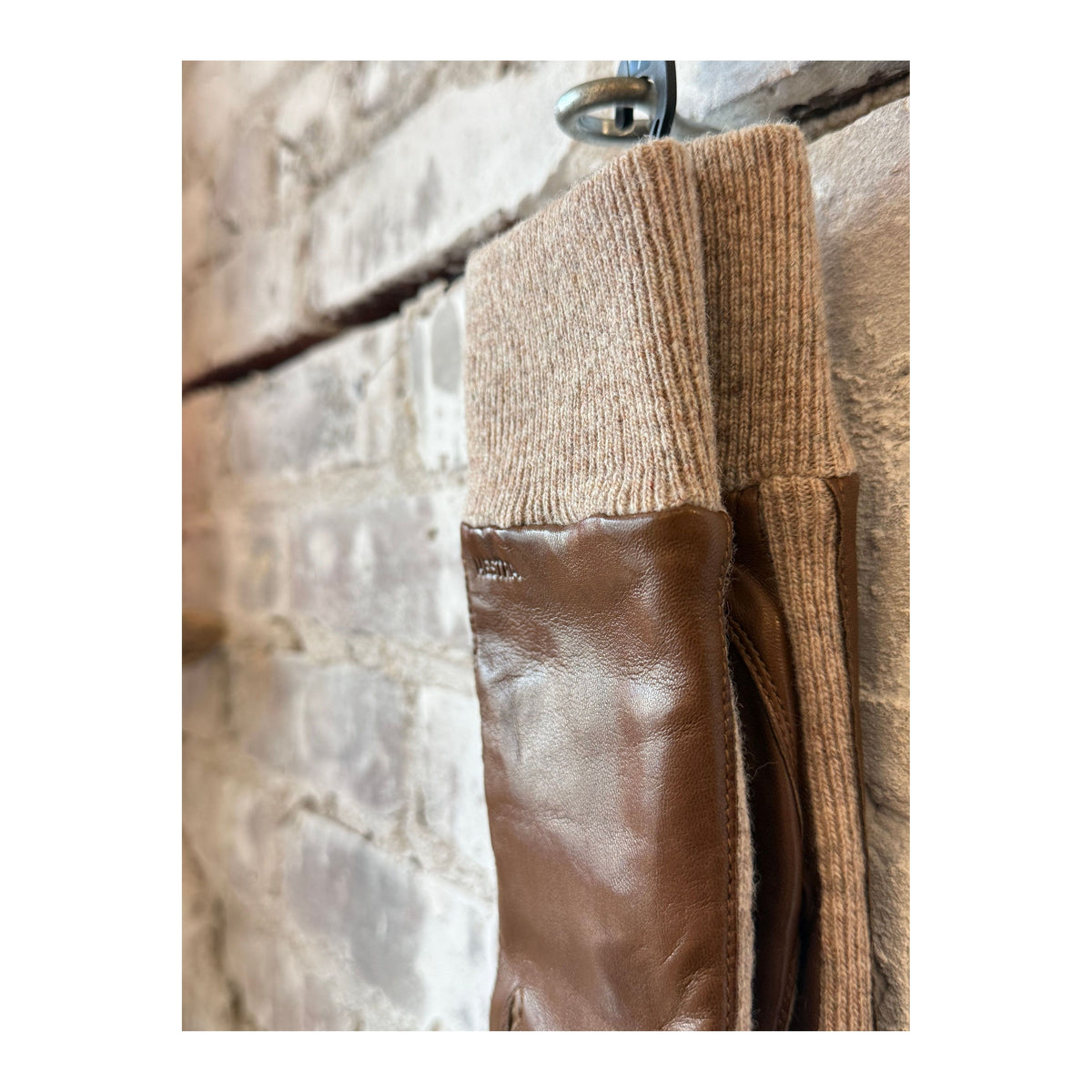 Hestra Jeanne women's light brown gloves with soft leather exterior and warm lining, designed for stylish winter wear.