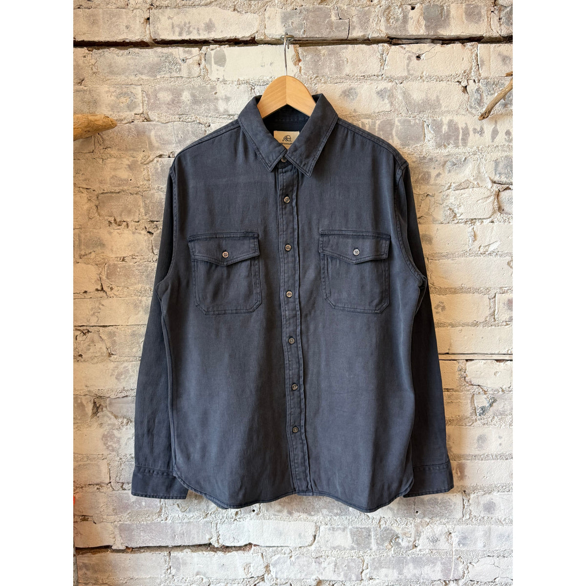 Navy men's Jeb Tencel shirt by Surfside Supply, featuring a relaxed fit and soft fabric, displayed on a hanger.