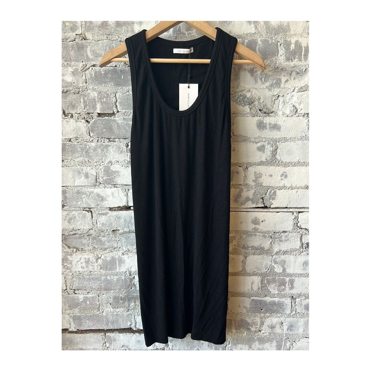 Black Gemini Rib Racerback Dress for women by John Elliot, close-up of fitted ribbed fabric and racerback design.